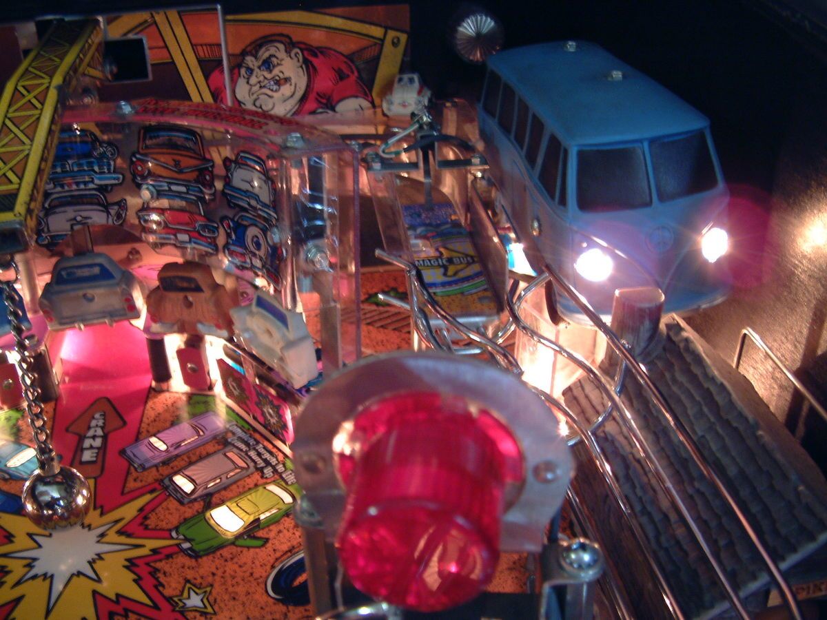 The real light-blue Magic Bus toy next to the red beacon dome.