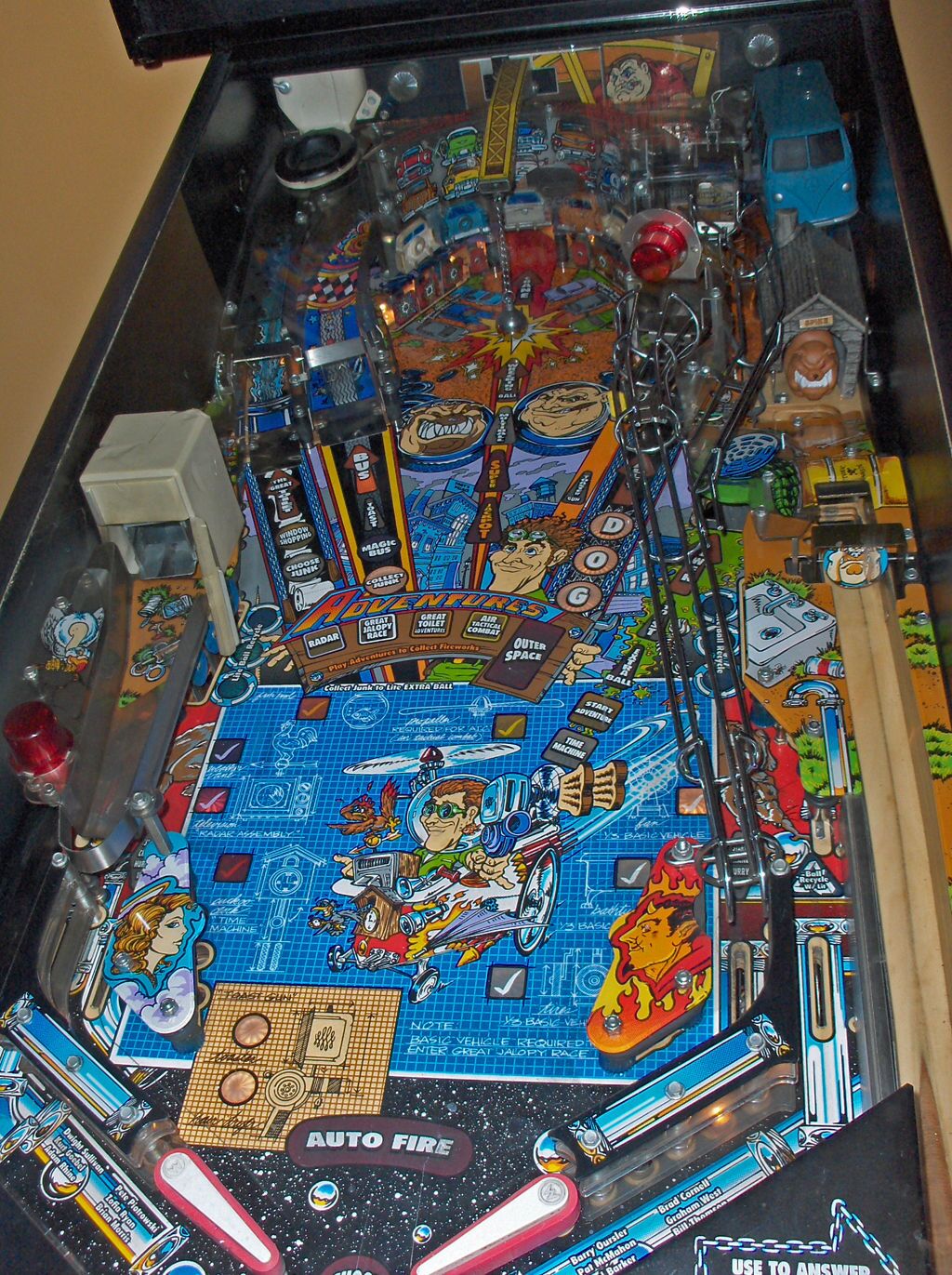 A real Junk Yard playfield photographed from the front, with its ramps, wire rails and toys.