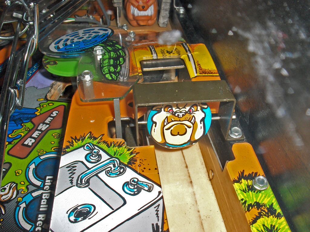 The top of the shooter lane: a spinner with Spike's face on it, and the launch hole.