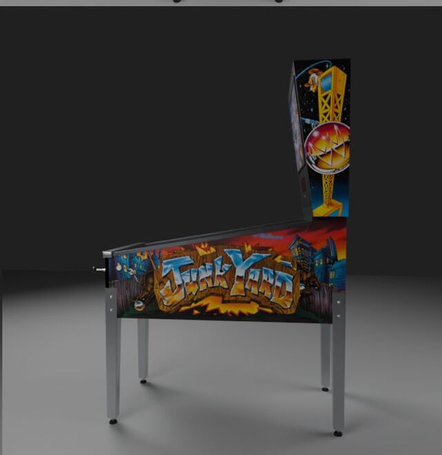 Our cabinet model from the side, with the redrawn Junk Yard side art and the crane on the backbox.